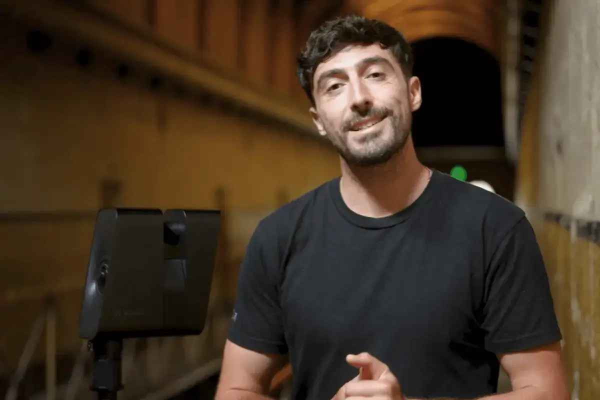 a man standing in front of camera with Matterport Pro3 LiDAR Camera